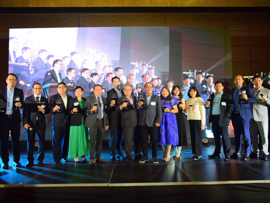 AMTI executives gathered for a toast to honor the company’s latest milestone./Contributed Photo