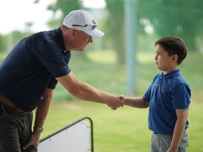 Stuart Hurstfield, a British PGA professional and Mimosa Plus director of instruction, with a student./ Contributed photo