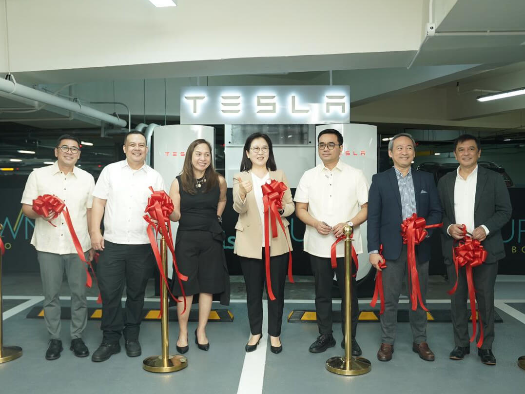 At the launch: (From left) Fort Bonifacio Barangay chair Jorge Bocobo, Energy Undersecretary Felix William “Wimpy” Fuentebella, Energy Undersecretary Sharon Garin,  Tesla regional director Isabel Fan, Energy Assistant Secretary Ronald Conquilla, Megaworld  VP & head for mall operations s upport department Rene Arnobit, and Board of Investments Director Ernesto Delos Reyes Jr./Contributed photo