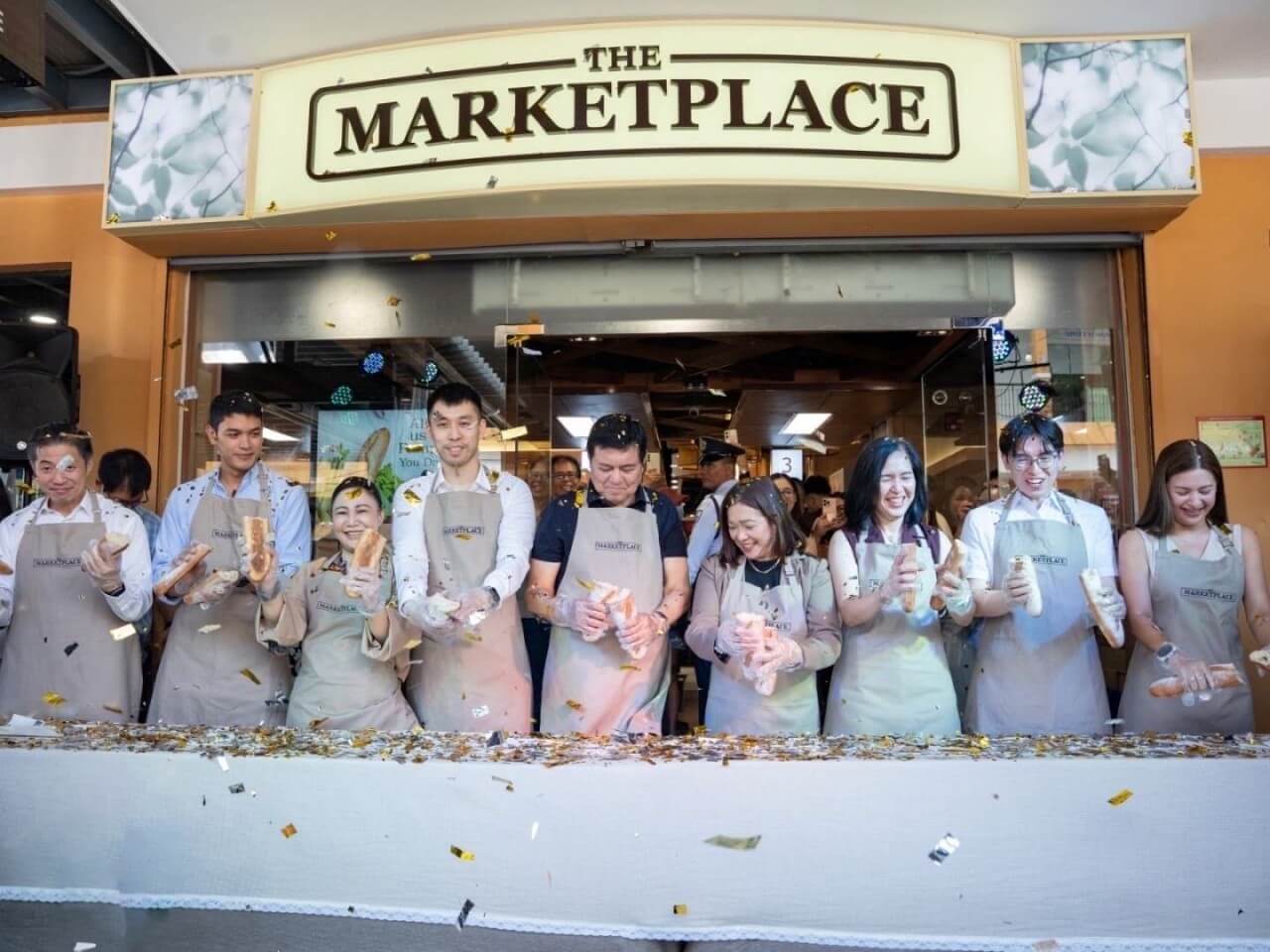 Former Sen. Manny Villar (center), chair of the Villar Group, at the opening of The Marketplace Vista Antipolo with key industry partners. From left are Bryan Wong, managing director of Kenvue; Mikel Posas, managing director of Dizon Farms; Amparo Rio, general manager of Nutri-Asia Inc.; Warren Chua, vice president of Nature's Harvest Corp.; Jing Laiz, vice president of Vista Malls; Marissa De Ungria, director and country manager of SC Johnson & Sons Inc.; Evan Chen, group manager of Bounty Plus Eggs; and Marie Loise Ticman-Canson, managing director for real estate and leasing at the Roblou Group of Companies.