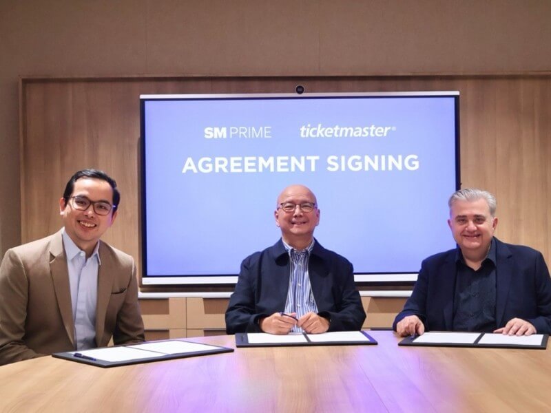 From left: SM Prime executive vice president Cris Noel E. Torres, SM Prime president Jeffrey C. Lim, and Ticketmaster APAC regional vice president Jim Kotsonis at the signing of the partnership agreement. | Contributed photo