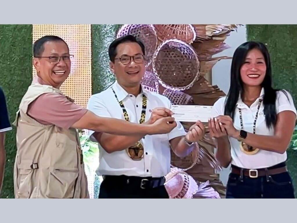 During the donation ceremony, Toyota Motor Philippines (TMP) Foundation operations manager Nelson Manglo (center) turns over a P3-million donation to the Tamaraw Conservation Program. Department of Environment and Natural Resources (DENR)-Mimaropa regional executive director Felix Mirasol Jr. (left) receives the donation, witnessed by MBCFI executive director Kathy Lene Cielo (right). MBCFI serves as the designated fund manager. | Contributed photo
