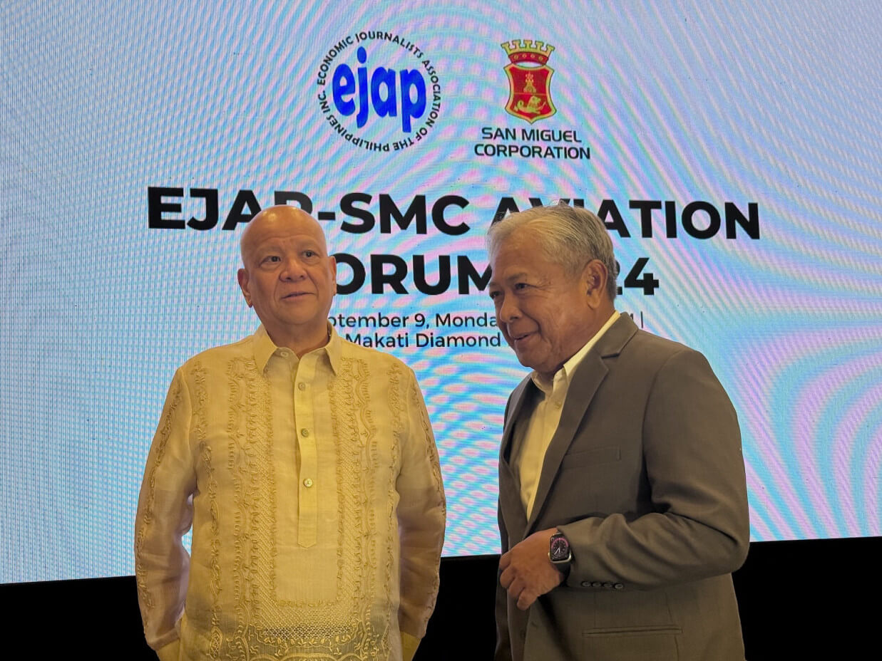 Transportation Sec. Jaime Bautista (right) with San Miguel Corp. chair and CEO Ramon Ang at Monday's EJAP Aviation Forum in Makati City.