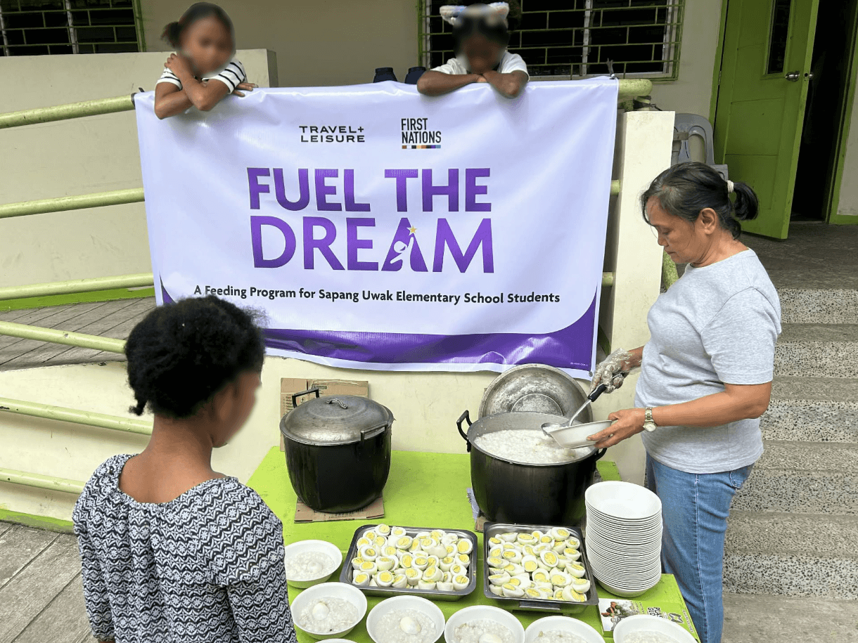 A teacher at Sapang Uwak Elementary School serves meals during the feeding program. Children&rsquo;s faces have been blurred at the request of the school principal and teachers to protect their identities. | Contributed photo