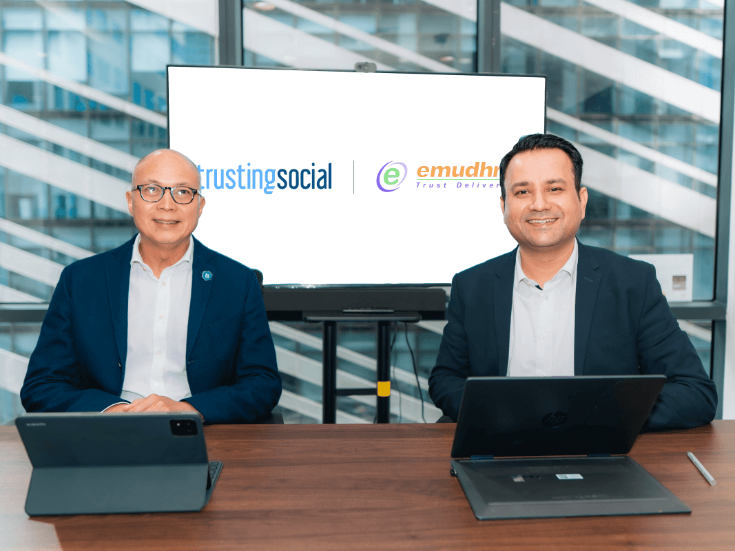 Trusting Social Philippines CEO Johnny Escaler and eMudhra Philippines country manager Rajat Gurnani sign a partnership agreement enabling a unified digital onboarding and signing platform. | Contributed photo