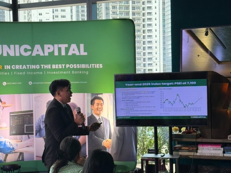 Unicapital Securities research analyst Peter Louise Garnace presents the firm’s mid-year outlook, where he announced a trimmed PSEi target of 7,100 and highlighted top stock picks in REITs, retail, and power./Photo by Miguel R. Camus 