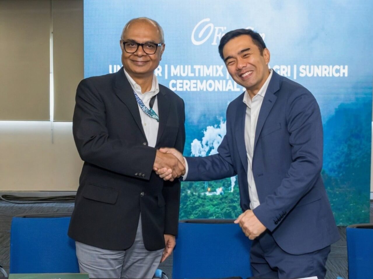 Arvind Sunderrajan (left), head of Unilever supply chain foods for Greater Asia head, and Carlo Vega, First Gen chief customer engagement officer, shake hands after they renewed an agreement for supply of geothermal electricity from First Gen to run seven of Unilever’s production and distribution sites in Luzon. | Contributed photo