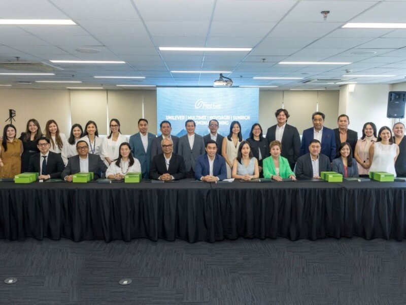 Officials and employees of Unilever Philippines and First Gen gather for a group photo after they renewed an agreement for supply of geothermal electricity from First Gen to run seven of Unilever’s production and distribution sites in Luzon. The officials include Arvind Sunderrajan (seated, fourth from left), Unilever supply chain foods for Greater Asia head; Rondell Torres (standing, seventh from left), Unilever sustainability lead; Jerome Cainglet (standing, ninth from left), EDC president; and Carlo Vega (seated fifth from left), First Gen chief customer engagement officer.| Contributed photo
