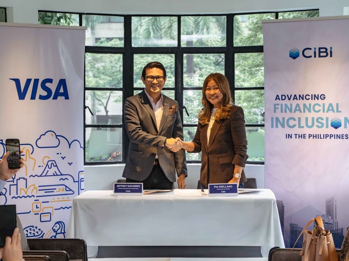 Jeffrey Navarro, country manager of Visa Philippines, and Pia Arellano, president and CEO of CIBI Information Inc. | Contributed photo