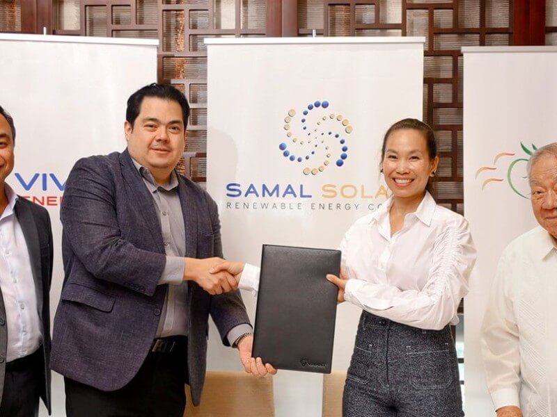 Vivant Energy president & COO Emil Andre Garcia and Tigon Power president & CEO Mayleen Ting share a handshake to mark their long-term partnership for the Bataan Solar Project, witnessed by Vivant Corp. CEO Arlo Sarmiento (left most) and Tigon Power chairman Elon Ting (right most).| Contributed photo (Click to ​view full image)