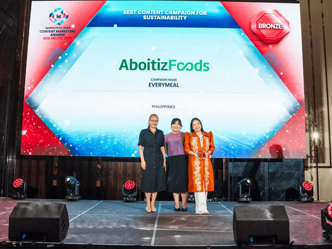 Sustainability champions. The Aboitiz Foods team onstage at the Content Marketing Awards Asia Pacific 2026 in Kuala Lumpur, celebratingthe everymeal campaign&rsquo;s recognition as the Bronze Award winner for Best Content Campaign for Sustainability. From left: Jas Li Hooi Gooh, assistant vice president for purchasing - Malaysia and Brunei; Anna Gail Carreon-Lubrico, communications manager, and Carla Camille Marcaida, brand & communications specialist.| Contributed photo