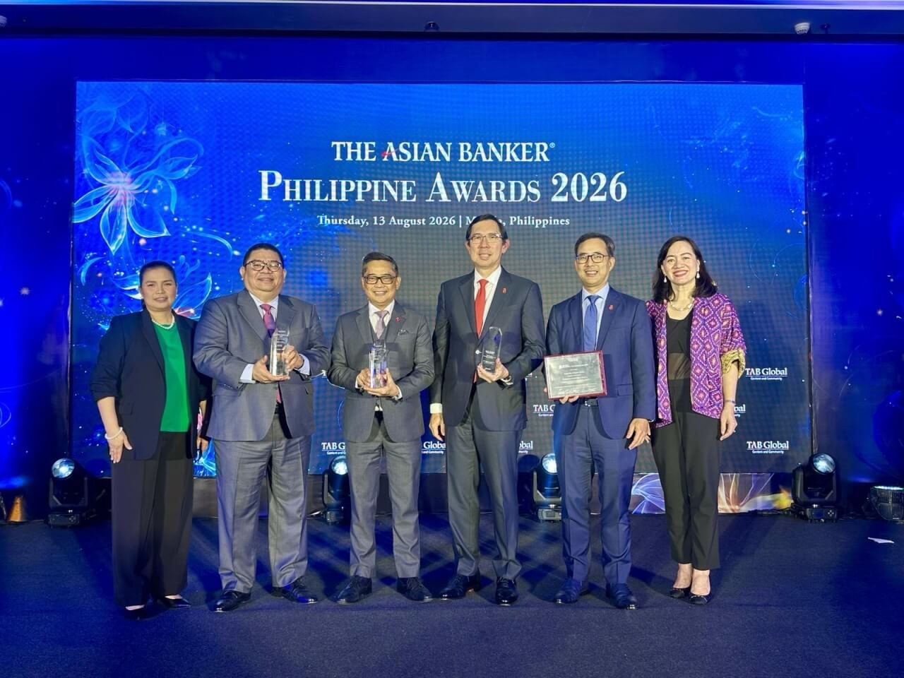 BPI leaders celebrate four major wins at The Asian Banker Philippine Awards 2026. From left: Glenda Gonzales, SVP and head of Consumer Banking &ndash; Shared Services Group; Dominique Ocliasa, SVP and head of Business Banking; Dennis Fronda, SVP and head of Branch Stores Channel; Jose Teodoro &ldquo;TG&rdquo; Limcaoco, president and CEO; Eric Luchangco, chief finance officer and chief sustainability officer; and Maricris San Diego, VP and head of Business Banking MSPC Division. | Contributed photo