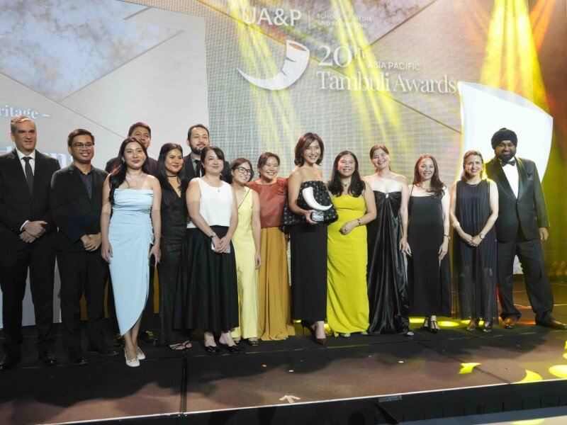 Cebu Pacific chief marketing and customer experience officer Candice Iyog (center), with marketing director Michelle Eve De Guzman standing to her left, joins members of the airline&rsquo;s marketing team and partners during the 2026 Asia Pacific Tambuli Awards, where the carrier received three honors for campaigns promoting Philippine tourism and culture./Photo taken by Jill Tan Radovan/adobo Magazine