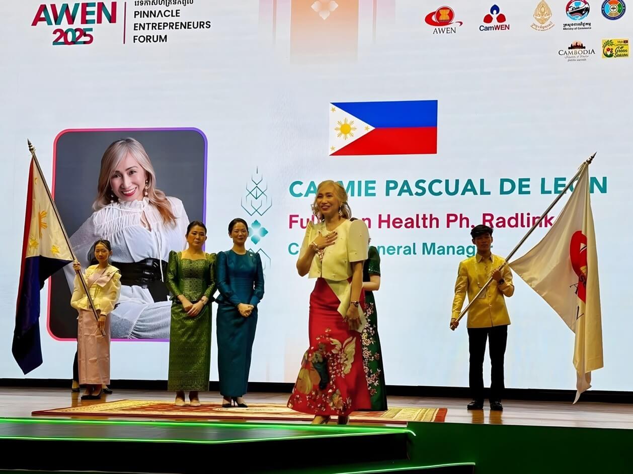 Radlink Philippines country general manager and Fullerton Health Philippines EHS lead Carmie De Leon (center) takes a bow as she receives an award at the 11th AWEN Awards 2025 held last November 21 in Phnom Penh, Cambodia. | Contributed photo