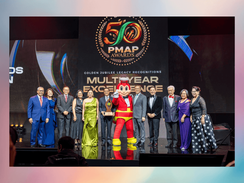 Jollibee Group celebrates its Multi-Year Excellence Award at the 50th PMAP Awards Night. Joining the celebration are Arsenio Sabado (far left), global chief human resources officer; Ruth Angeles (second from left), Philippines chief human resources officer and HR head for Jollibee Brand International; Ernesto Tanmantiong (left of Jollibee mascot), global president and CEO; and Joseph Tanbuntiong (right of mascot), Philippines CEO and head of Jollibee Brand Global. | Contributed photo
