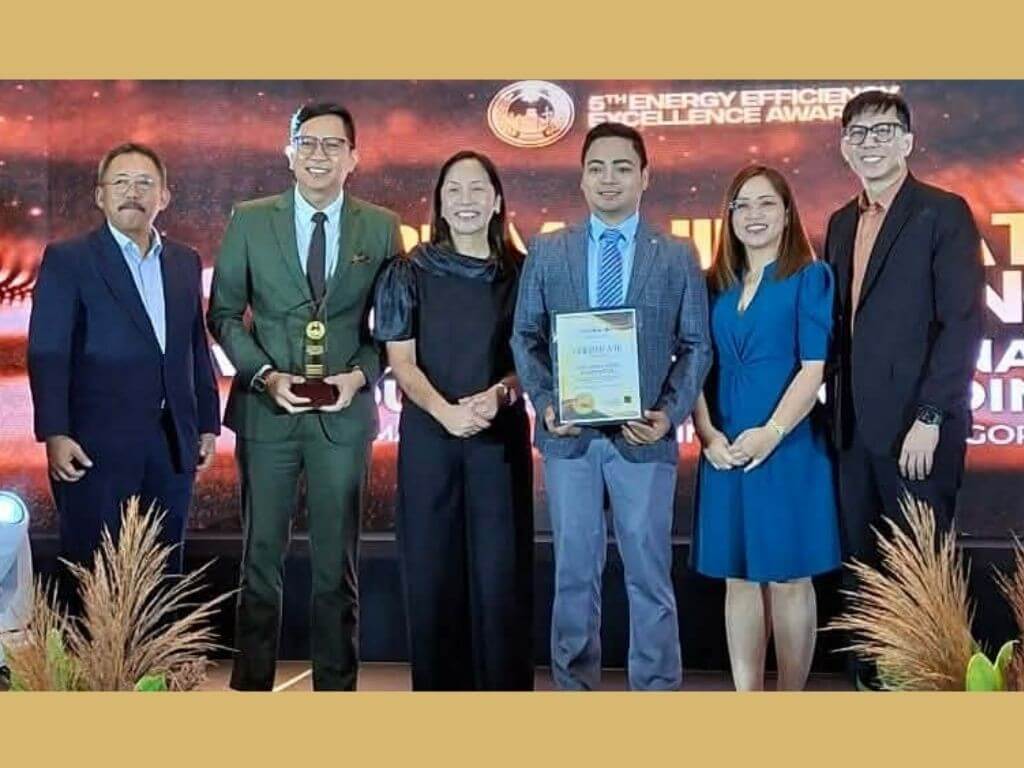 MWPV regional operations director for VisMin, Estate Water, and MWIS Robbie Vasquez (center left) and MWC energy director King Verzola (center right) receive the 2025 DOE Energy Efficiency Excellence Award under the Energy Management of Small and Medium Industry category from Energy Secretary Sharon Garin (center). &nbsp;| Contributed photo
