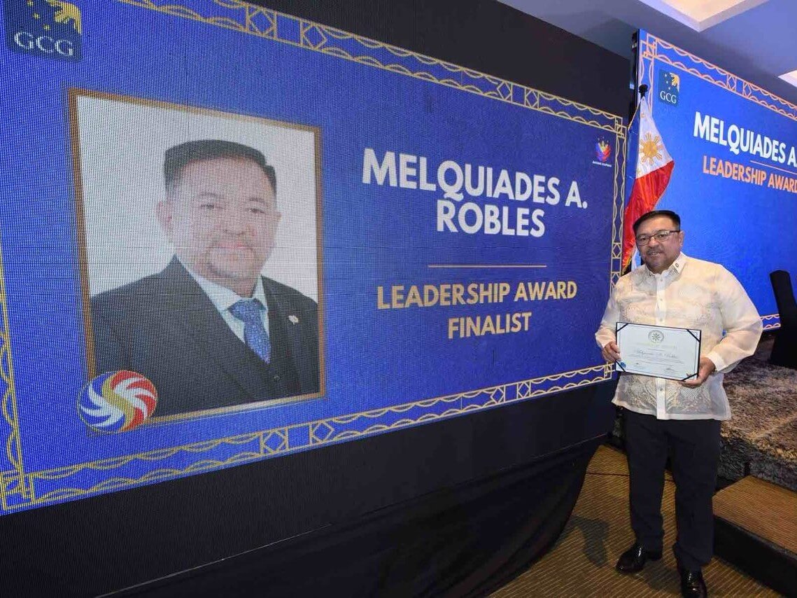 PCSO chief Mel Robles received the award recently from the GCG recognizing the agency's achievements./Contributed Photo