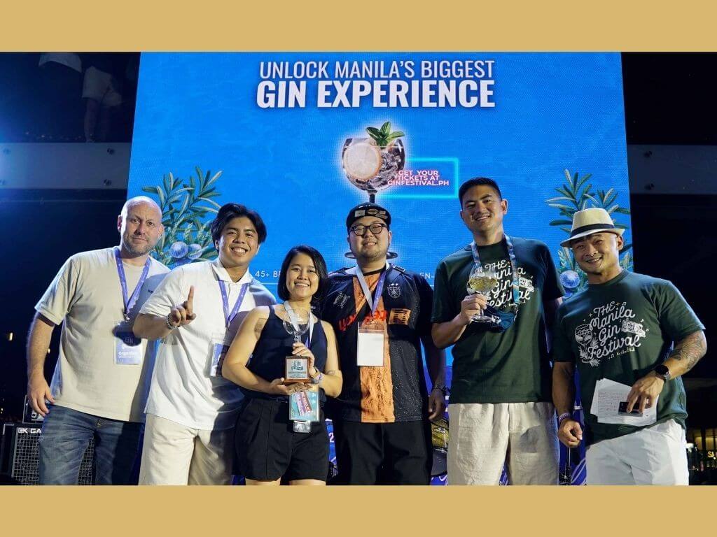 The Tanduay team, led by Special Projects Unit head Madel Pamfilo (third from left), receives its Best Booth-Premium Category Award at the Manila Gin Festival 2026. She is joined on stage by management trainees Luis Lico and Sedric Cantor (second &nbsp;and fourth &nbsp;from left). | Contributed photo