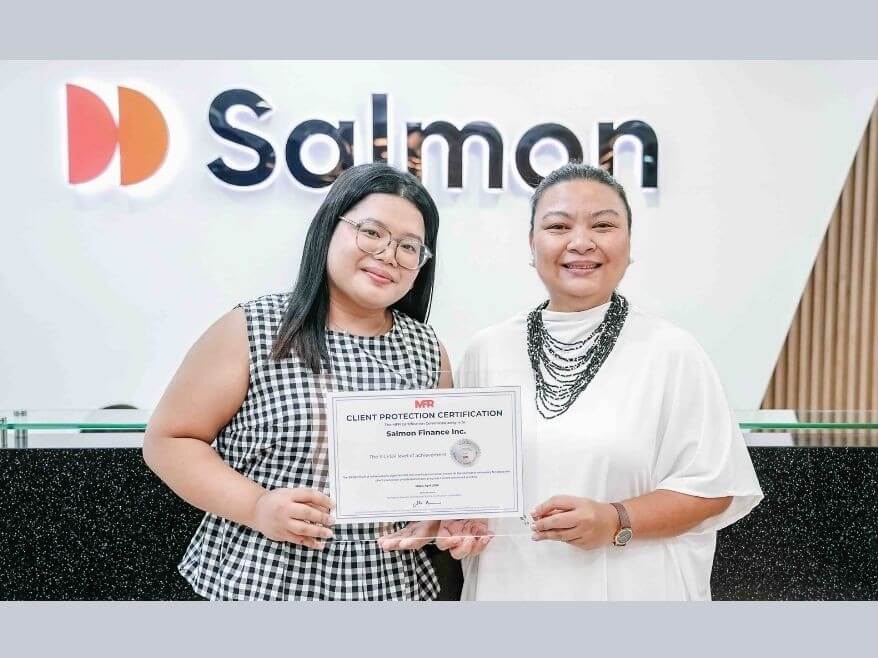 Salmon Group chief compliance officer Eunice Monsod (right), together with Salmon Finance compliance officer Yvonne Ablanida, receive the Client Protection Certification under the Cerise+SPTF Protection Standards, which was awarded based on the independent assessment by MicroFinanza Rating. | Contributed photo